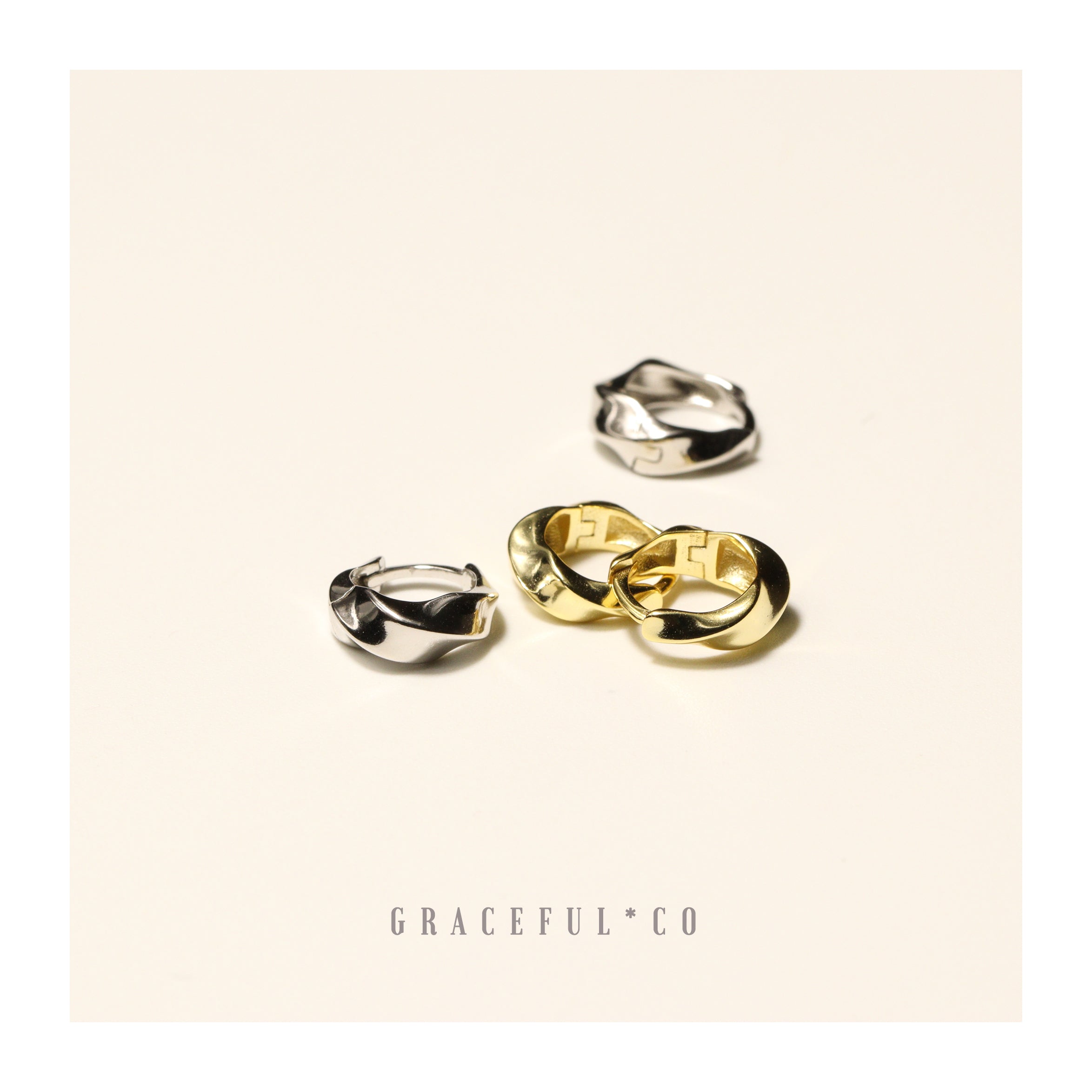 Dawn Twist Huggie Earrings